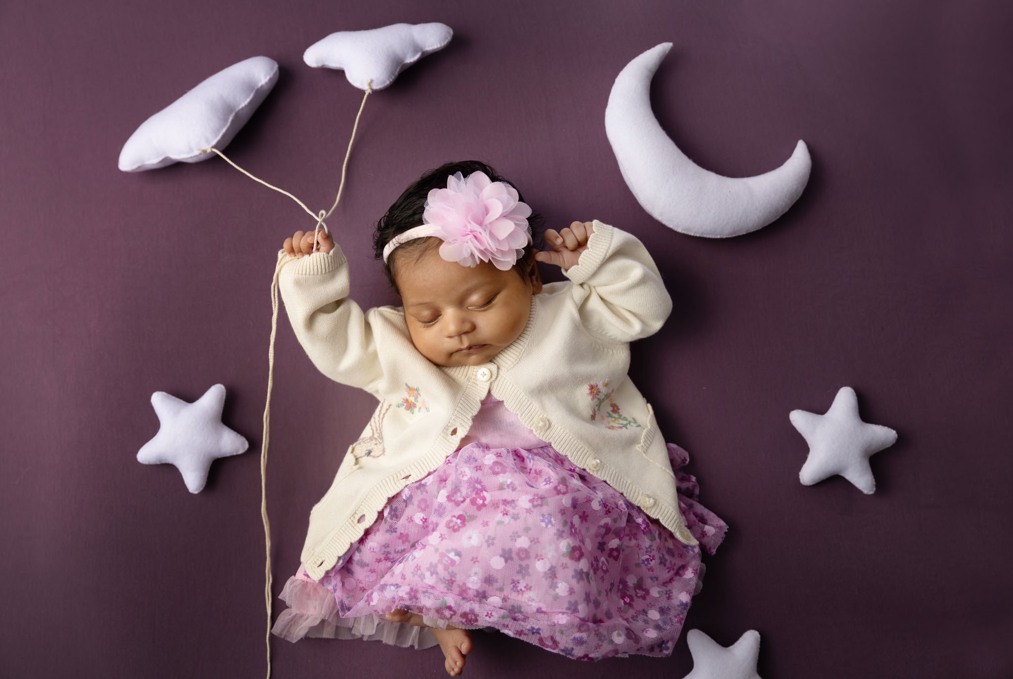 Newborn baby home photoshoot with family using styled outfits and natural light