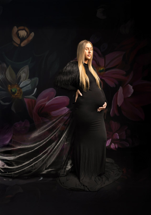 golden hair model in black gown for pregnancy photoshoot