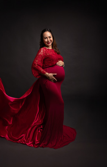 Studio maternity shoot with elegant posing and professional styling