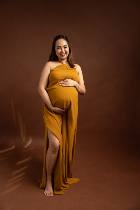 Studio maternity shoot with custom gowns in UAE