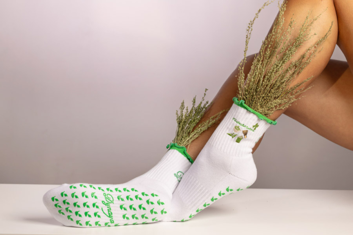 Studio product photography of Pilates socks with curated props and textures