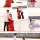 Luxury maternity photoshoot at JBR Beach Dubai with pregnant woman wearing elegant gown at sunset
