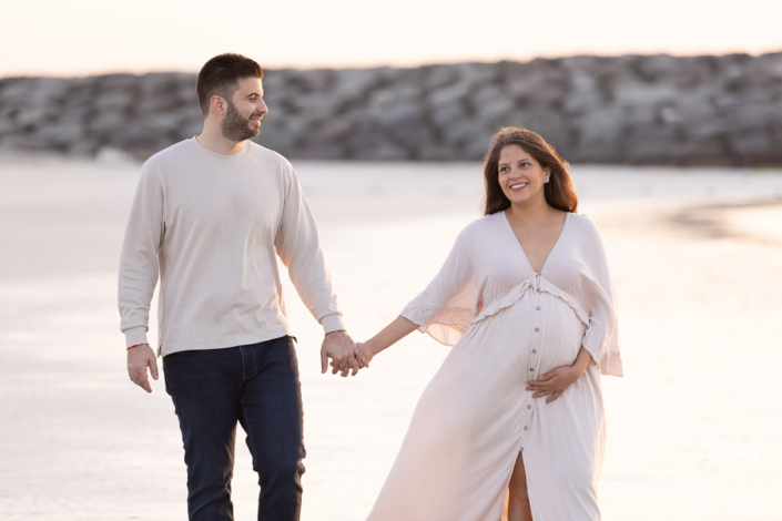 Minimal beach maternity photoshoot in Dubai with calm ocean background Title