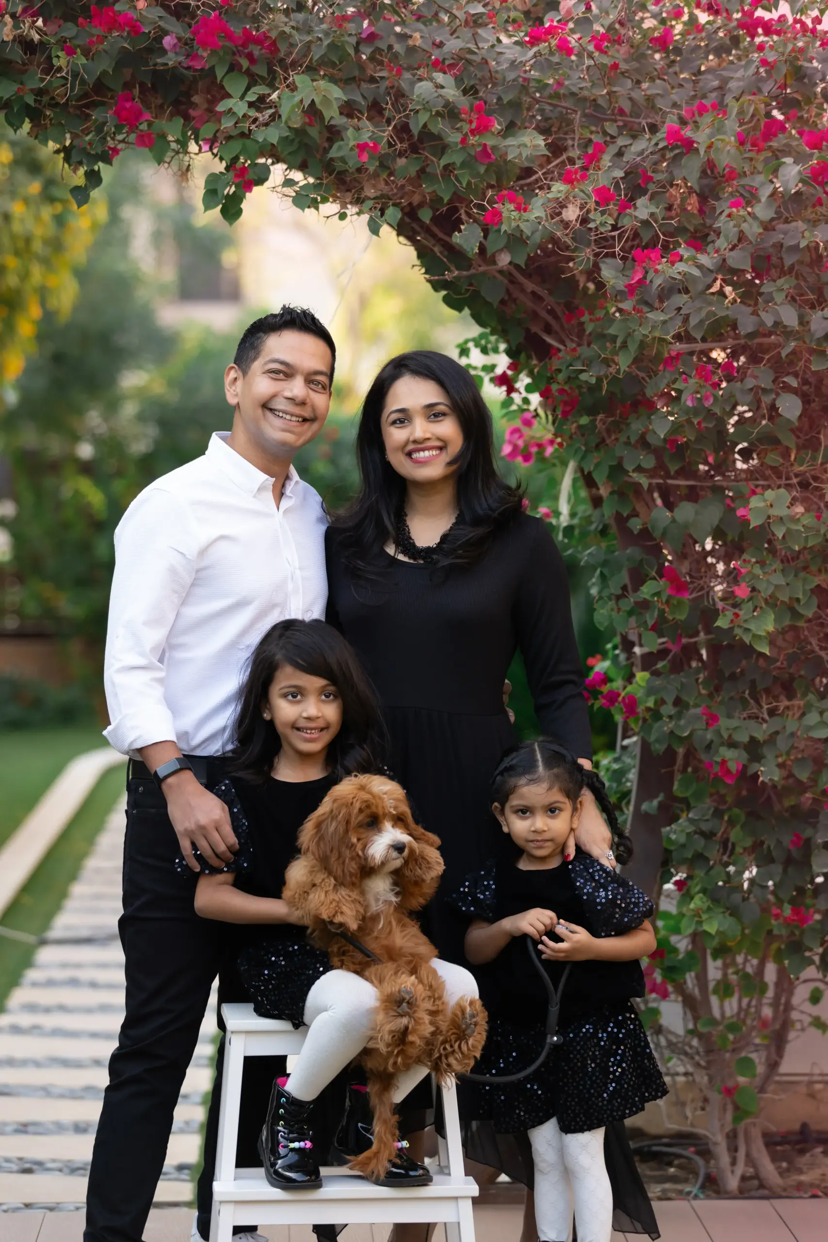 family standing in garden