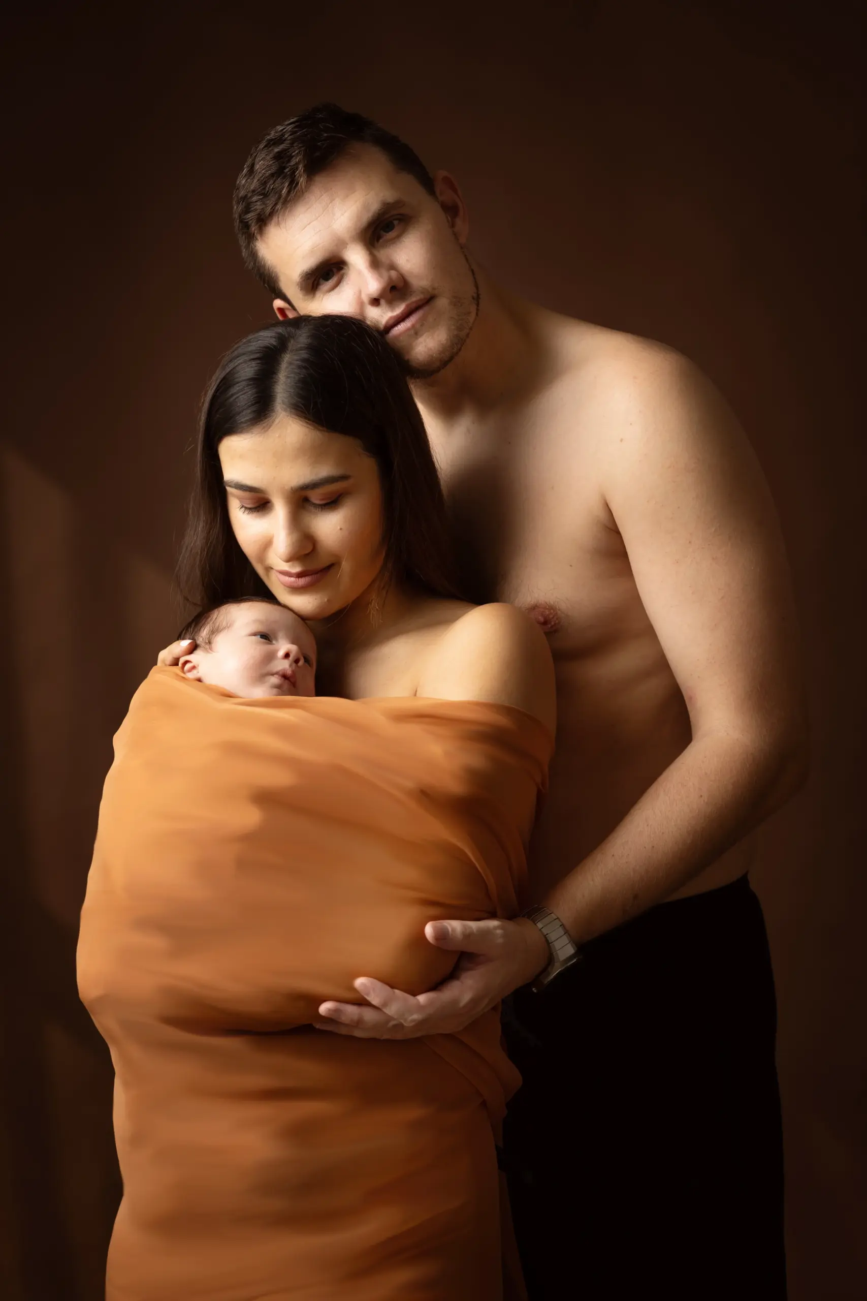 Newborn photography props safely supported during a baby photoshoot