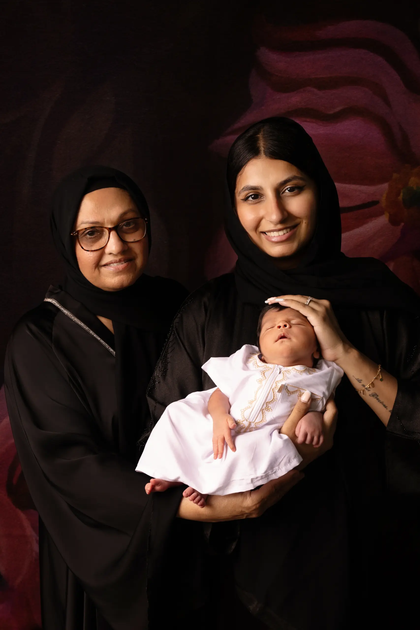 Newborn baby wrapped safely in soft fabric during photography session