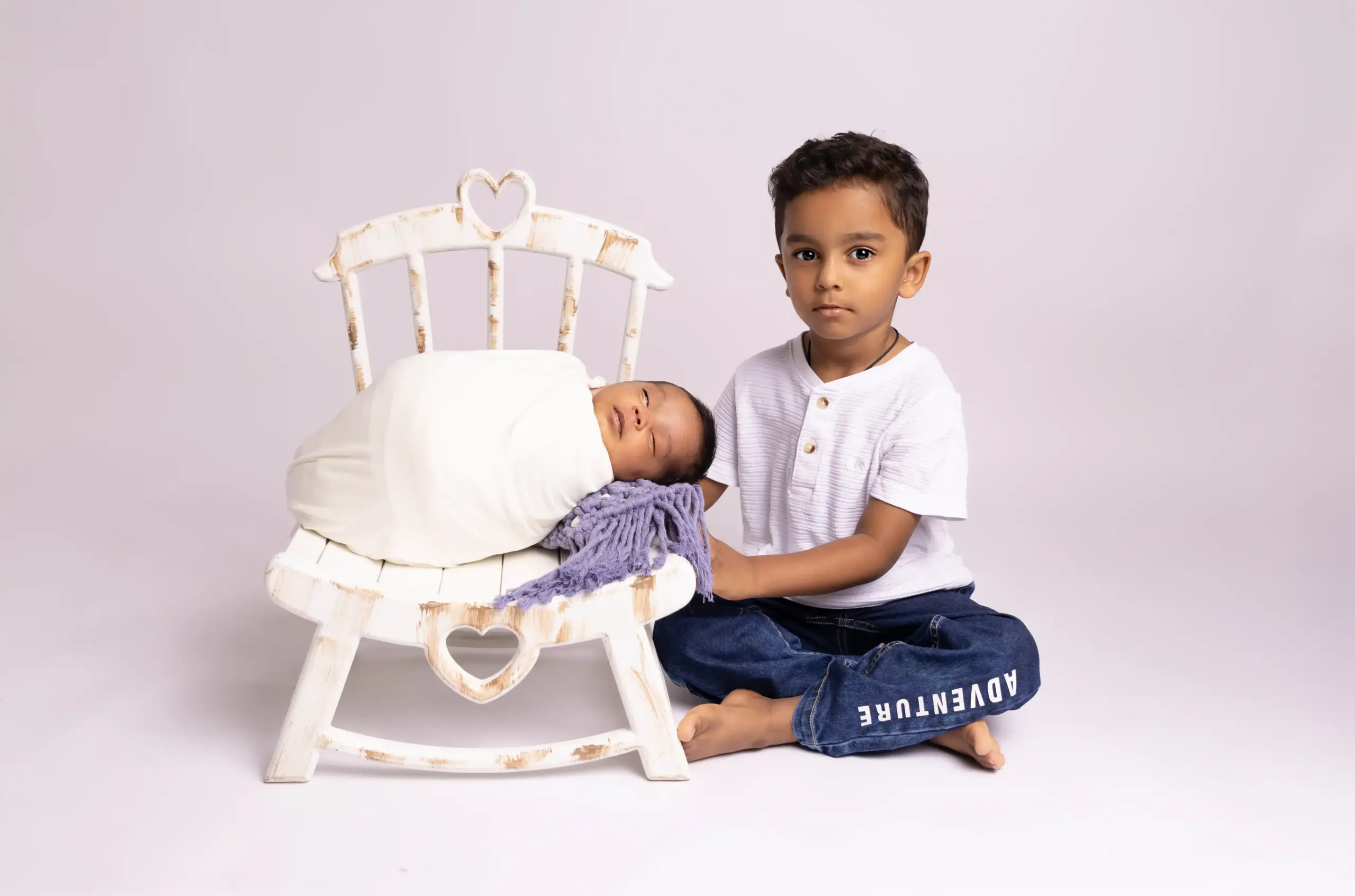 Newborn baby comfortably sleeping during a safe photography session